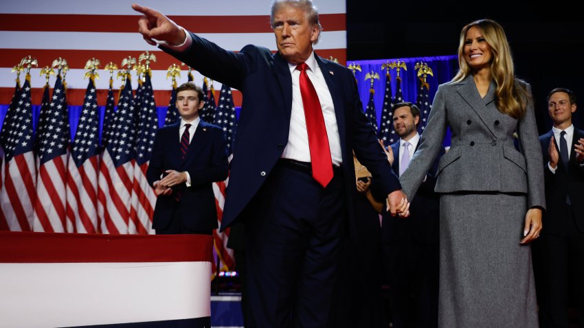 WEST PALM BEACH, FLORIDA – NOVEMBER 06:  Republican presidential nominee, former U.S. President Donald Trump points to supporters with former first lady Melania Trump during an election night event at the Palm Beach Convention Center on November 06, 2024 in West Palm Beach, Florida. Americans cast their ballots today in the presidential race between Republican nominee former President Donald Trump and Vice President Kamala Harris, as well as multiple state elections that will determine the balance of power in Congress.   (Photo by Chip Somodevilla/Getty Images)