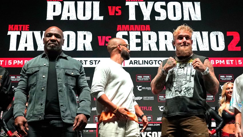 US boxer Mike Tyson (L) and US boxer-actor Jake Paul (R) pose during a press conference ahead of their heavyweight bout at The Pavilion at Toyota Music Factory in Irving, Texas on November 13, 2024. (Photo by TIMOTHY A. CLARY / AFP) (Photo by TIMOTHY A. CLARY/AFP via Getty Images)