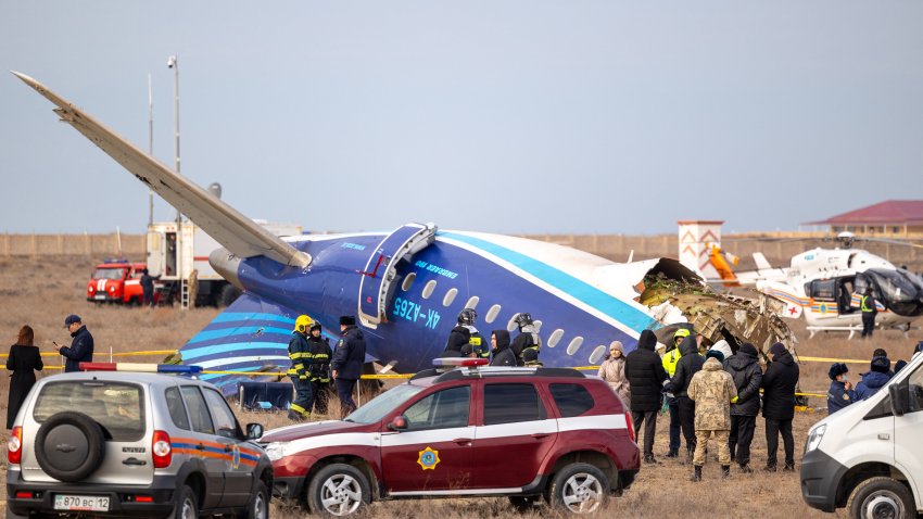 Emergency specialists work at the crash site of an Azerbaijan Airlines passenger jet near the western Kazakh city of Aktau on December 25, 2024. (Photo by Issa Tazhenbayev / AFP) (Photo by ISSA TAZHENBAYEV/AFP via Getty Images)