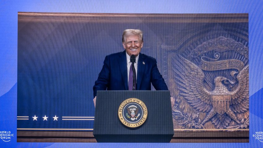 US President Donald Trump is seen on a large screen during his address by video conference at the World Economic Forum (WEF) annual meeting in Davos on January 23, 2025. (Photo by Fabrice COFFRINI / AFP) (Photo by FABRICE COFFRINI/AFP via Getty Images)