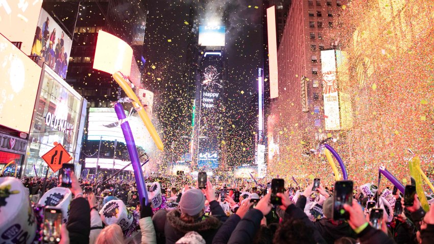 NEW YORK, NY – JANUARY 01: Revelers watch and record as confetti falls over Times Square to celebrate the New Year of 2025 on January 1, 2025 in New York City. (Photo by Liao Pan/China News Service/VCG via Getty Images)