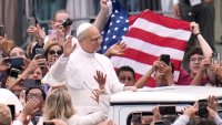 Pope Leo XIV waves as he arrives for his first weekly general audience in St. Peter’s Square at The Vatican, Wednesday, May 21, 2025. (AP Photo/Gregorio Borgia)