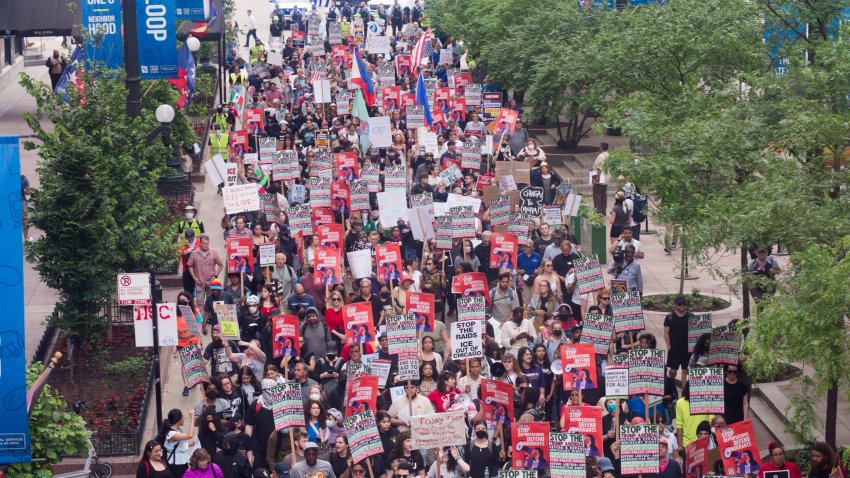 CHICAGO, ILLINOIS, UNITED STATES – JUNE 12: Protesters march through downtown Chicago, Illinois, United States on June 12, 2025, during the second day of demonstrations against Immigration and Customs Enforcement (ICE) raids and President Donald Trump’s immigration policies. Carrying signs reading ‘Abolish ICE’ and ‘No More Deportations,’ thousands rally in solidarity with immigrant communities, chanting for justice and an end to family separations. (Photo by Jacek Boczarski/Anadolu via Getty Images)