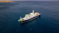 This aerial picture shows a general view of the cruise ship MV Hondius stationary off the port of Praia, the capital of Cape Verde, on May 3, 2026. An outbreak of "severe acute respiratory illness" on board a cruise ship in the Atlantic has left two people dead and a third in intensive care in Johannesburg, South Africa’s health ministry told AFP on May 3, 2026.
The outbreak occurred on the MV Hondius, travelling from Ushuaia in Argentina to Cape Verde. The patient being treated in Johannesburg tested positive for a hantavirus, a family of viruses that can cause hemorrhagic fever, South African spokesperson Foster Mohale said. (Photo by AFP via Getty Images)