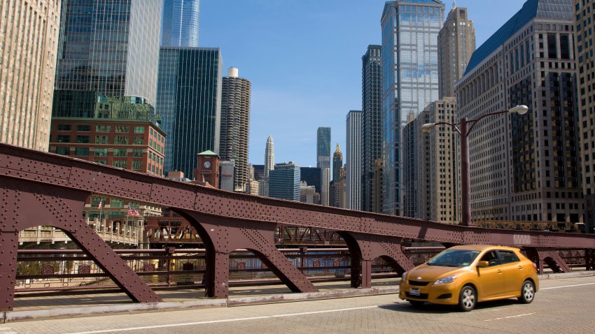 CHICAGO, IL – MARCH 26:  A car drives across the Carroll Street Bridge on March 26, 2012 in Chicago, Illinois.  Chicago’s unusually moderate winter and spring weather has been a boost to the local tourism economy. (Photo by George Rose/Getty Images)